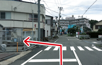 Turn left at the intersection with the crosswalk. (No traffic signal there) The mark of the intersection, you will see “Mukai Barbershop”.